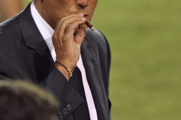 Italian national football team's coach Marcello Lippi smokes a cigar upon his arrival at Larnaca's stadium on September 5, 2008 on the eve of their World Cup 2010 qualifying football match against Cyprus.   AFP PHOTO/ ARIS MESSINIS (Photo credit should read ARIS MESSINIS/AFP/Getty Images)